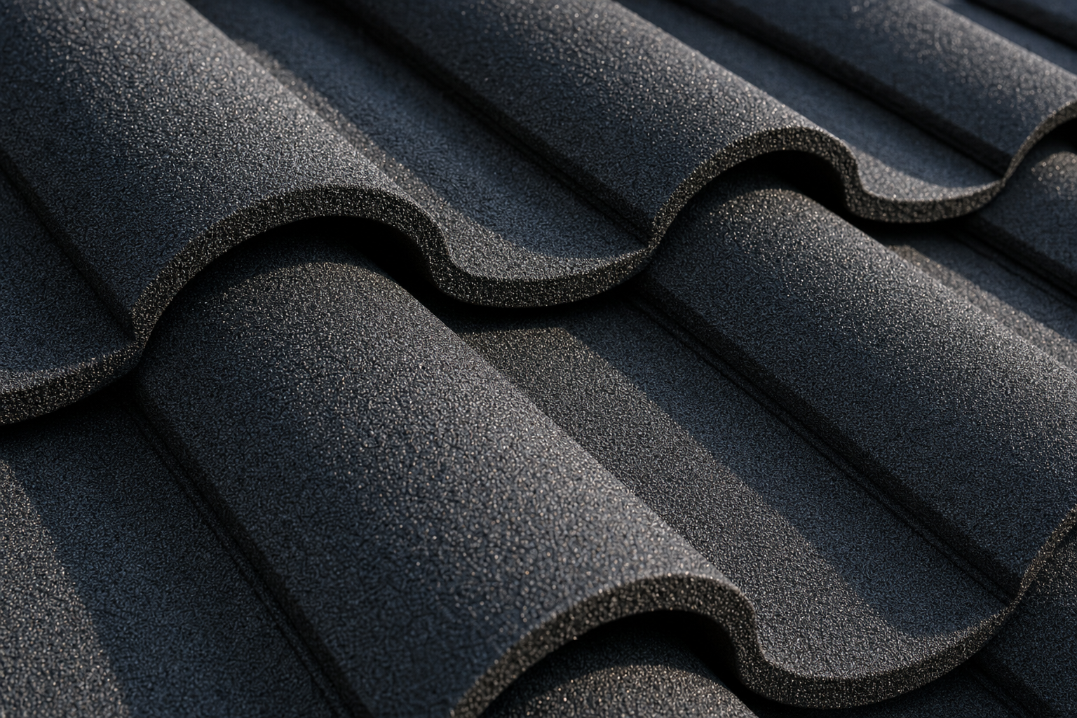 Close-up of stone-coated metal tile texture, barrel S-profile