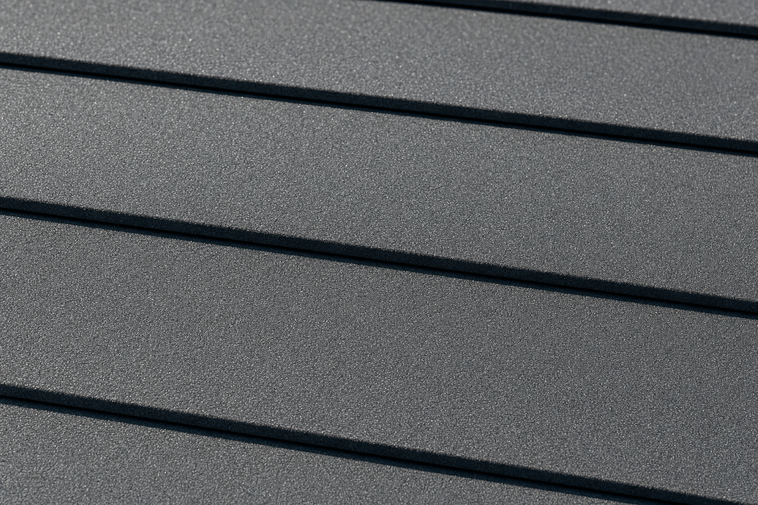 Contemporary flat profile stone-coated metal tile