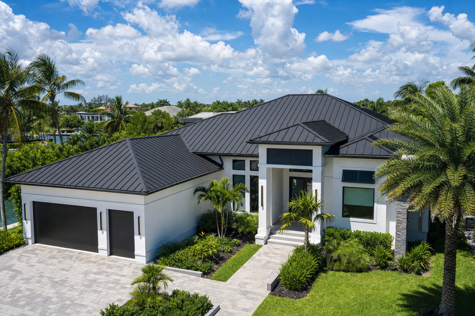 Completed standing seam metal roof, modern waterfront home, charcoal